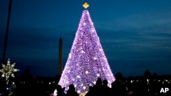 The 2016 National Christmas Tree with the Washington Monument in the background is shown on the Ellipse near the White House, in Washington, Dec. 3, 2016. 
