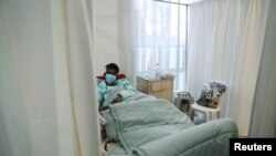 A patient being treated at a makeshift hospital run by charity organisation The Gift of the Givers, during the coronavirus disease (COVID-19) outbreak in Johannesburg, South Africa, July 10, 2021.