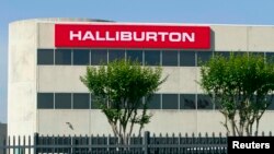 FILE - Corporate offices for Halliburton oilfield services are in Houston, Texas. The U.S. Justice Department is suing to prevent the firm from acquiring rival Baker Hughes Inc. 