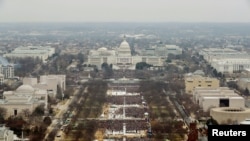 FILE - Attendees partake in the inauguration ceremonies to swear in Donald Trump as the 45th president of the United States at the U.S. Capitol in Washington, Jan. 20, 2017.