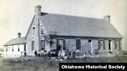 FILE - Photo shows first Fort Sill Indian School near Lawton, Ok., which operated from its opening in 1871 until 1899-1900. 2027, Josiah Butler Collection.