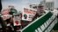 For the eighth day in a row, people hold banners as they demonstrate against police brutality in Lagos, Nigeria, Oct. 15, 2020.