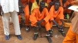 This undated photo shows prisoners sitting together at the central prison in the capital Juba, South Sudan. A new Amnesty International report accuses authorities in South Sudan of torturing people to death in detention and letting many others languish.