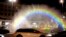 Cars drive past a light-and-water rainbow installation on the night before a gay pride parade, in downtown Warsaw, Poland, June 8, 2018. A conservative turn in Poland has made the fight for gay rights all the more difficult.