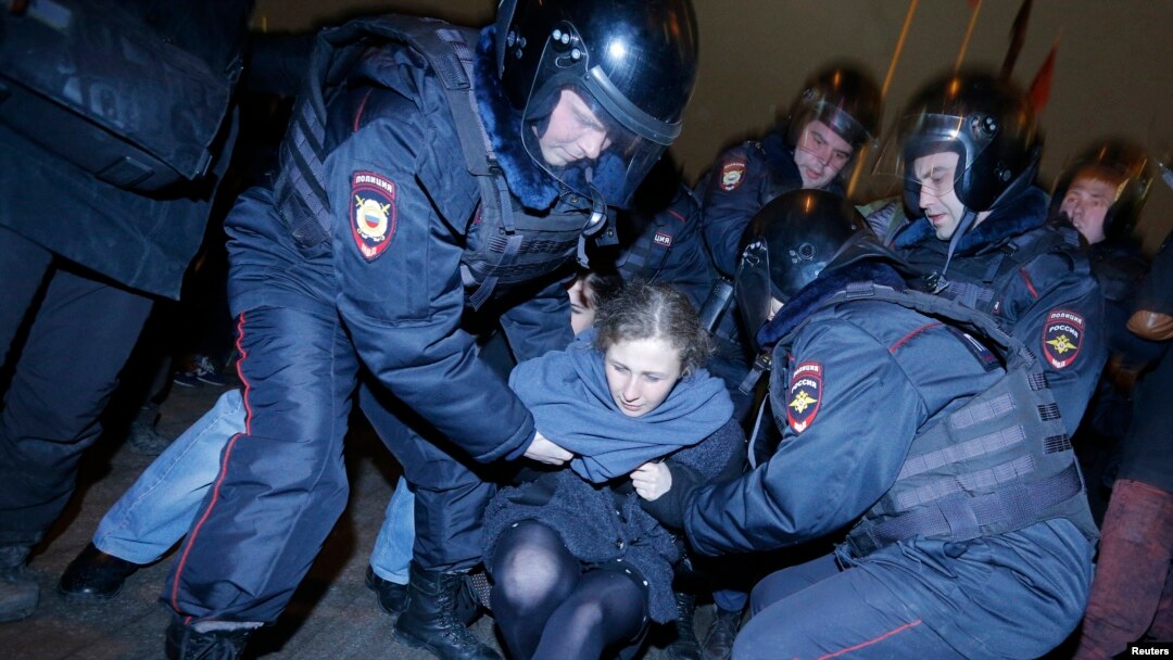 FILE - Punk protest band Pussy Riot member Maria Alyokhina is detained by police at a protest in central Moscow February 24, 2014.