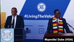 Botswana President Duma Gideon Boko, left, and Zimbabwe President Emmerson Mnangagwa make an address outside SADC offices in Gabarone, Botswana, Dec. 13, 2024.