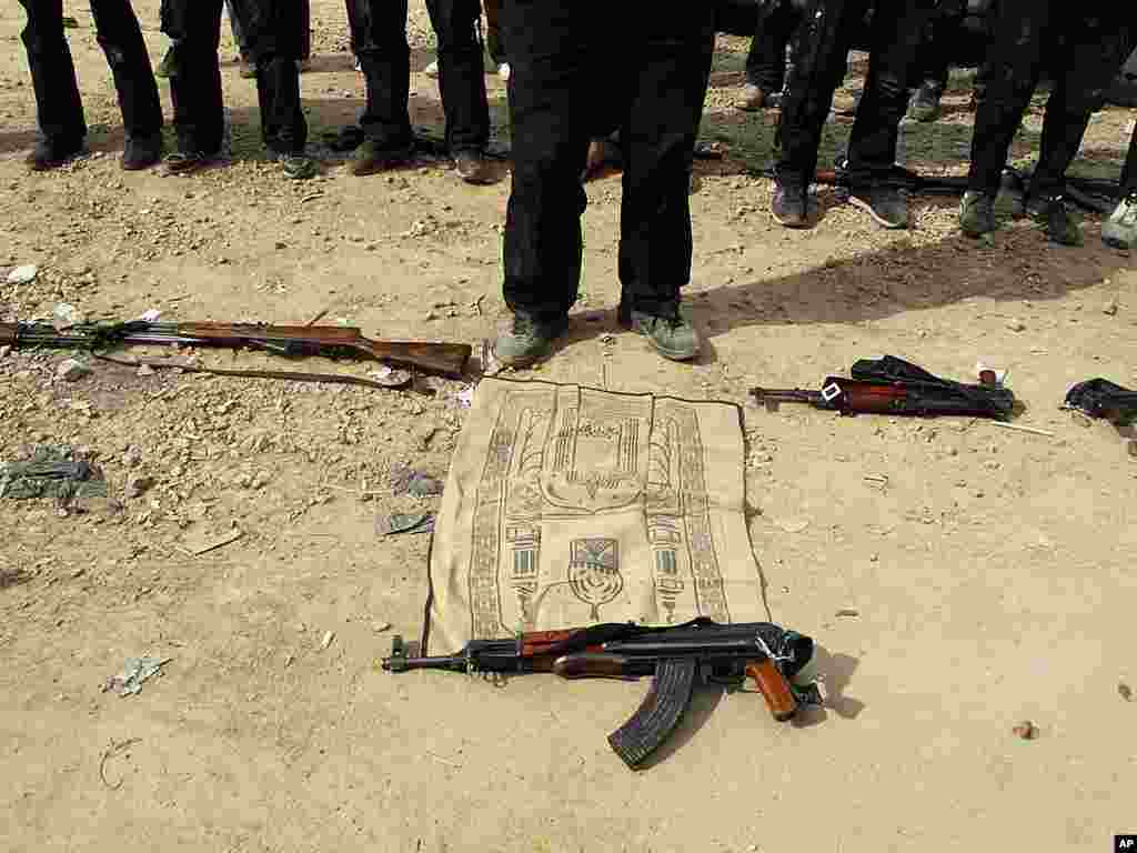 Free Syrian army fighters perform noon prayers in a neighborhood in Damascus. (AP)