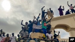 FILE - Supporters of Niger's ruling junta gather at the start of a protest called to fight for the country's freedom and push back against foreign interference in Niamey, Niger, Aug. 3, 2023. 