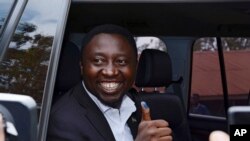 FILE—Presidential candidate Frank Habineza, of the opposition Democratic Green Party, gives the thumbs up after casting his ballot in Rwanda's capital Kigali, August 4, 2017,