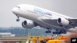 FILE - An Airbus A380 takes off for a demonstration flight at the Paris Air Show in Le Bourget, north of Paris, June 18, 2015.