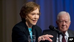 FILE - Rosalynn Carter, left, and her husband former President Jimmy Carter update donors about current activities of the Carter Center in Atlanta, April 23, 2010.