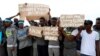 FILE - Migrants are seen at a detention center in Tripoli, Libya, April 4, 2019. 