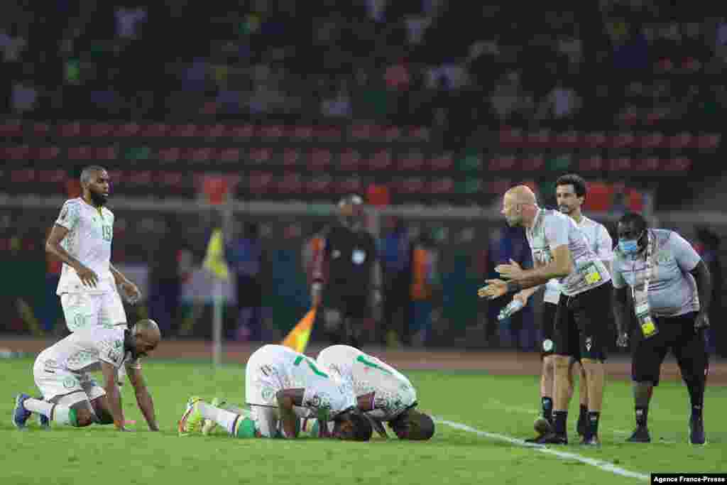 Comoros players celebrate after Comoros' midfielder Youssouf M'Changama scored their team's first goal against host country in Cameroon, Jan. 24, 2022.