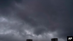 Storm clouds hover over the Fukushima Azuma Baseball Stadium at the 2020 Summer Olympics, July 27, 2021, in Fukushima, Japan. 