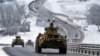 A convoy of Russian armored vehicles moves along a highway in Crimea, Jan. 18, 2022.