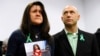 Jeremy Richman, with wife Jennifer Hensel holding a portrait of their daughter, Avielle Rose Richman, who was killed in the Sandy Hook school shooting, Newtown, Conn., Jan. 14, 2013. 