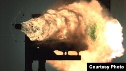 This photograph, taken from a high-speed video camera, shows a record-setting firing of an electromagnetic railgun at Naval Surface Warfare Center, Dahlgren, Virginia, Jan. 31, 2008. (Photo courtesy of U.S. Navy)