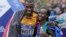Kenya's Stanley Biwott (L) embraces fellow Kenyan Mary Keitany after the pair won the men's and women's professional athlete divisions in the the New York City marathon, Nov. 1, 2015, in New York.