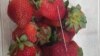 A thin piece of metal is seen among a punnet of strawberries in Gladstone, Australia, Sept. 14, 2018. (Credit: AAP/Queensland Police/Handout)