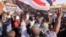 Protesters march during a rally against military rule following a coup nearly three months ago, in Khartoum, Sudan, Jan. 24, 2022.