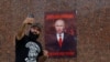 Activists mark Russian President Putin's birthday in Donetsk