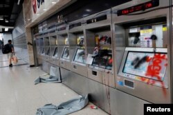 Damaged ticket machines are seen inside Sha Tin MTR station after an anti-government rally at New Town Plaza at Sha Tin, Hong Kong, Sept. 22, 2019