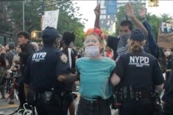 Protesters arrest a protestor during a rally at the Barclays Center over the death of George Floyd, a black man who was in police custody in Minneapolis Friday, May 29, 2020, in the Brooklyn borough of New York.