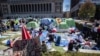 A sign sits erected at the pro-Palestinian demonstration encampment at Columbia University in New York, April 22, 2024.