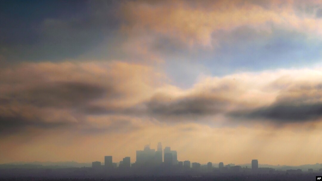 FILE - In this Oct. 26, 2018, file photo, downtown Los Angeles is shrouded in early morning coastal fog and smog.