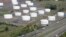 FILE - Traffic on I-95 passes Citgo oil storage tanks in Linden, N.J., Sept. 8, 2008. Venezuela will hold onto its U.S.-based Citgo refineries, settling in Nov. 2018 a lawsuit that threw ownership of the struggling country’s prized assets into peril. 