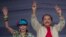 FILE - Nicaragua's President Daniel Ortega, right, and first lady Rosario Murillo, wave to supporters during an event commemorating the 36th anniversary of the Sandinista National Liberation Front withdrawal to Masaya, in Managua, Nicaragua, July 3, 2015.