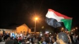 Demonstrators gather outside the army headquarters in Sudan's capital, Khartoum, May 11, 2021, on the anniversary of the killing of Sudanese protesters during a raid on an anti-government sit-in in 2019. 