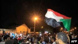 Demonstrators gather outside the army headquarters in Sudan's capital, Khartoum, May 11, 2021, on the anniversary of the killing of Sudanese protesters during a raid on an anti-government sit-in in 2019. 