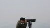 FILE - A South Korean army soldier watches the North Korea side from the Unification Observation Post in Paju, South Korea, near the border with North Korea, Dec. 25, 2019. 