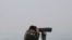 FILE - A South Korean army soldier watches the North Korea side from the Unification Observation Post in Paju, South Korea, near the border with North Korea, Dec. 25, 2019. 