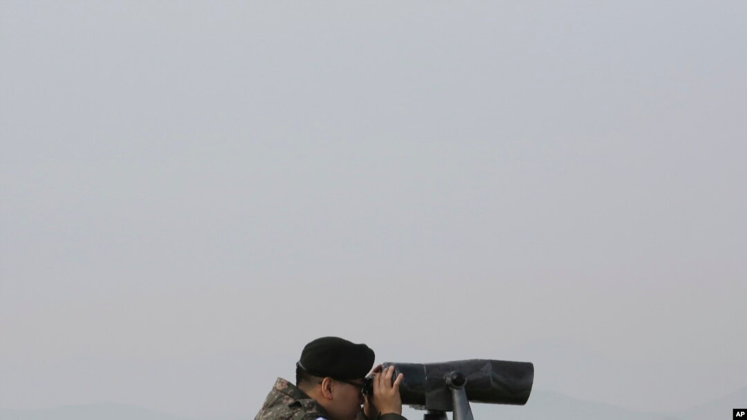 FILE - A South Korean army soldier watches the North Korea side from the Unification Observation Post in Paju, South Korea, near the border with North Korea, Dec. 25, 2019. 