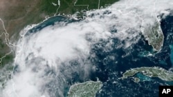 This satellite image from Sept. 8, 2024, shows a tropical depression in the Gulf of Mexico. Tropical Storm Francine formed off the coast of Mexico on Sept. 9, 2024, and is expected to lash Texas with rain, then hit Louisiana as a hurricane. (NOAA via AP)