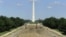 Tourists walk past work underway to reconstruct the Lincoln Memorial Reflecting Pool on the National Mall in Washington, May 11, 2011.