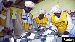 Southern Sudan Referendum Commission staff members prepare the official counting of votes on South Sudanese independence. The Civilian Response Corps supported U.S. efforts to help Sudan carry out its referendum on independence.