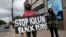 People gather to protest the death of a black man Monday night in police custody in Minneapolis, May 26, 2020.
