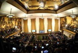 FILE - The first meeting of the new Syrian Constitutional Committee gets under way at the United Nations in Geneva, Switzerland, Oct. 30, 2019.