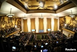 FILE - The first meeting of the new Syrian Constitutional Committee gets under way at the United Nations in Geneva, Switzerland, Oct. 30, 2019.