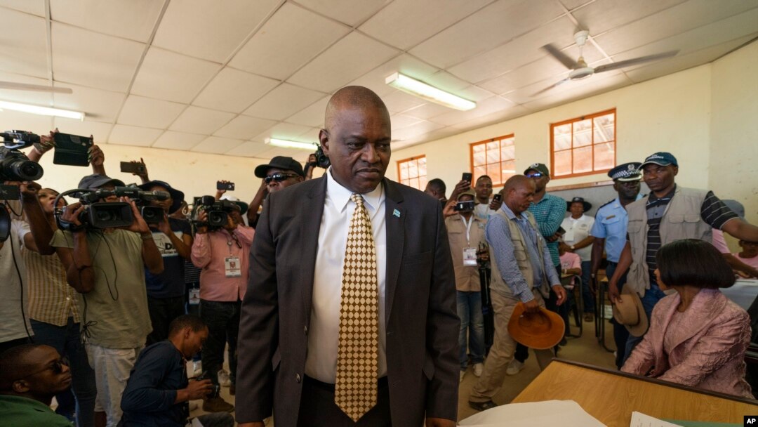 Botswana's President Mokgweetsi Masisi arrives to vote in general elections in Moshupa, Botswana, Oct. 23, 2019. On Tuesday Masisi announced a state of emergency after the African country recorded its first confirmed COVID-19 cases.