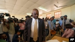 Botswana's President Mokgweetsi Masisi arrives to vote in general elections in Moshupa, Botswana, Oct. 23, 2019. On Tuesday Masisi announced a state of emergency after the African country recorded its first confirmed COVID-19 cases.