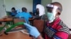 FILE - Workers prepare face shields from recycled plastics at the Zaidi Recyclers workshop as a measure to stop the spread of coronavirus disease (COVID-19) in Dar es Salaam, Tanzania.