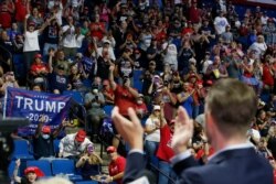 President Donald Trump's supporters cheer Eric Trump, his son, before a Trump campaign rally in Tulsa, Okla., June 20, 2020.