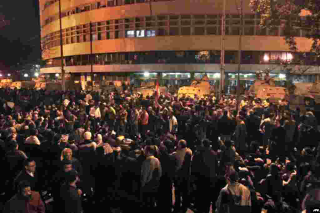 Anti-government protesters surround the state television building following Egyptian President Hosni Mubarak's televised speech, on the Corniche in downtown Cairo, Egypt Thursday, Feb. 10, 2011. Mubarak refused to step down or leave the country and instea