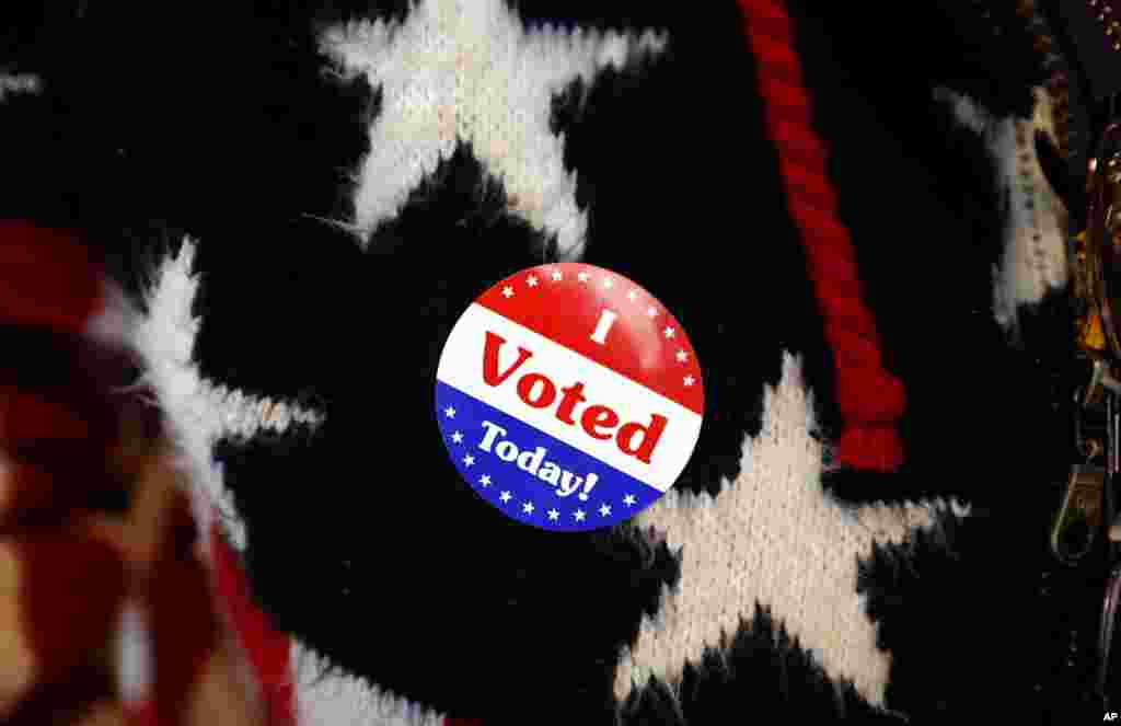 Maria Morahn, of Osceola, Iowa, wears a sticker after casting her ballot in the general election, Nov. 6, 2018, at the United Methodist Church in Osceola, Iowa. 