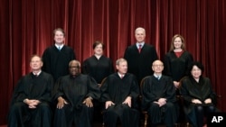 In April 23, 2021, photo, Supreme Court members pose for a group photo. Seated from left: Samuel Alito, Clarence Thomas, John Roberts, Stephen Breyer and Sonia Sotomayor. Standing from left: Brett Kavanaugh, Elena Kagan, Neil Gorsuch, Amy Coney Barrett.