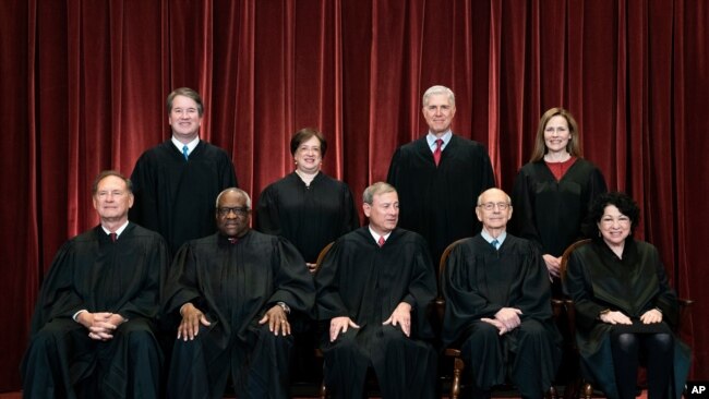 In April 23, 2021, photo, Supreme Court members pose for a group photo. Seated from left: Samuel Alito, Clarence Thomas, John Roberts, Stephen Breyer and Sonia Sotomayor. Standing from left: Brett Kavanaugh, Elena Kagan, Neil Gorsuch, Amy Coney Barrett.